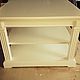 Coffee table with square top. has two compartments for storing books, magazines, Souvenirs. Decorative plates with flutings give the table uncluttered and aesthetically pleasing appearance. The differ