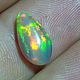 Яркий Эфиопский опал "Махаон" 2 ct (12,5*6,9*5,9 мм). Кабошоны. Сокрытое в Листве. Ярмарка Мастеров.  Фото №5