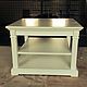 Coffee table with square top. has two compartments for storing books, magazines, Souvenirs. Decorative plates with flutings give the table uncluttered and aesthetically pleasing appearance. The differ