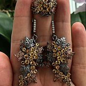 Earrings made of silver with natural topaz and sapphires