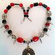 Necklace made of natural stones ethnic Eastern style of Genghis Khan. Bright red coral necklace with black agate, silver beads and a vintage pendant. Handmade jewelry.