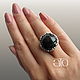 Made to order. Luxurious ring with a stunning Australian black opal.
