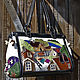 Bag is new in our assortment. The main applique on the front wall, additional on the sides and small rear bags.
