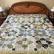 Patchwork quilted blue bedspread