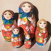 Matryoshka with her son in a red coat