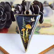 The pendant is made of resin with real flowers. pendant on a chain
