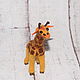 `Roams an exquisite giraffe..` miniature.

