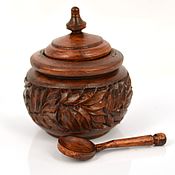 Carved wooden pencil holder with pine cones