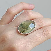 In reserve. Silver ring with tourmaline