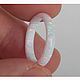 Narrow white ring made of synthetic opal