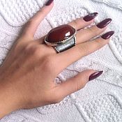 Nur.  925 silver ring with garnets