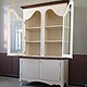 White sideboard in the style of Provence. Elegant, simple and functional. Has two compartments. Top with wing glass doors is crowned by a beautiful cornice, three spacious shelves will serve to
