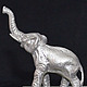 Miniature `Elephant`. There are statues of dogs: Dachshund, Bichon Frise, Airedale Terrier, poodle, Spaniel, Pekingese. There are figurines of other animals: bear, turtle, cat, mouse, rat, snake (Cobr