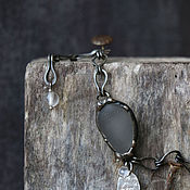 Necklace: with a textile pendant 