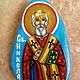 A hand-painted icon of the st.Nikolas on a natural stone. The stone is from the Black Sea shore. The icon is painted with tempered paints and is fixed with varnish coating.Size-8x5cm.