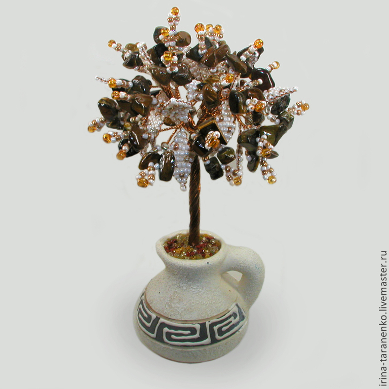 Tree from the tiger eyes vase made of white clay
