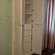 Multifunctional large built-in wardrobe. Has two large wing equipped with storage units . They are equipped with spacious shelves, shelves for storage of clothes, drawers and units
