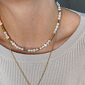 Necklace with mother of pearl and gilded beads