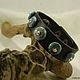 Leather bracelet with turquoise overlays
