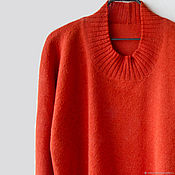 The cardigan is knitted of Alpaca wool