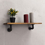 Industrial style wall shelves made of wood and pipes