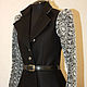 Warm, fitted jacket with voluminous sleeves, a black and white decision
