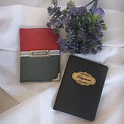 Paired passport covers and auto documents in a gift box