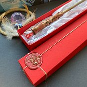 A magic wand with quartz in a box
