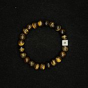 Украшения handmade. Livemaster - original item A bracelet made of tiger`s eye beads and silver. Handmade.