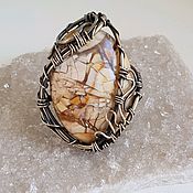 Ring with a sunstone (heliolite)