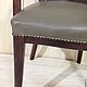 Oak chair, covered with leather and decorated with metal furniture buttons. Incredibly comfortable - it will be a truly favorite piece of furniture. When ordering, specify color of skin, poss