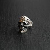A ring with a skull made of silver