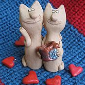 breadwinner. ceramics. figures of cats