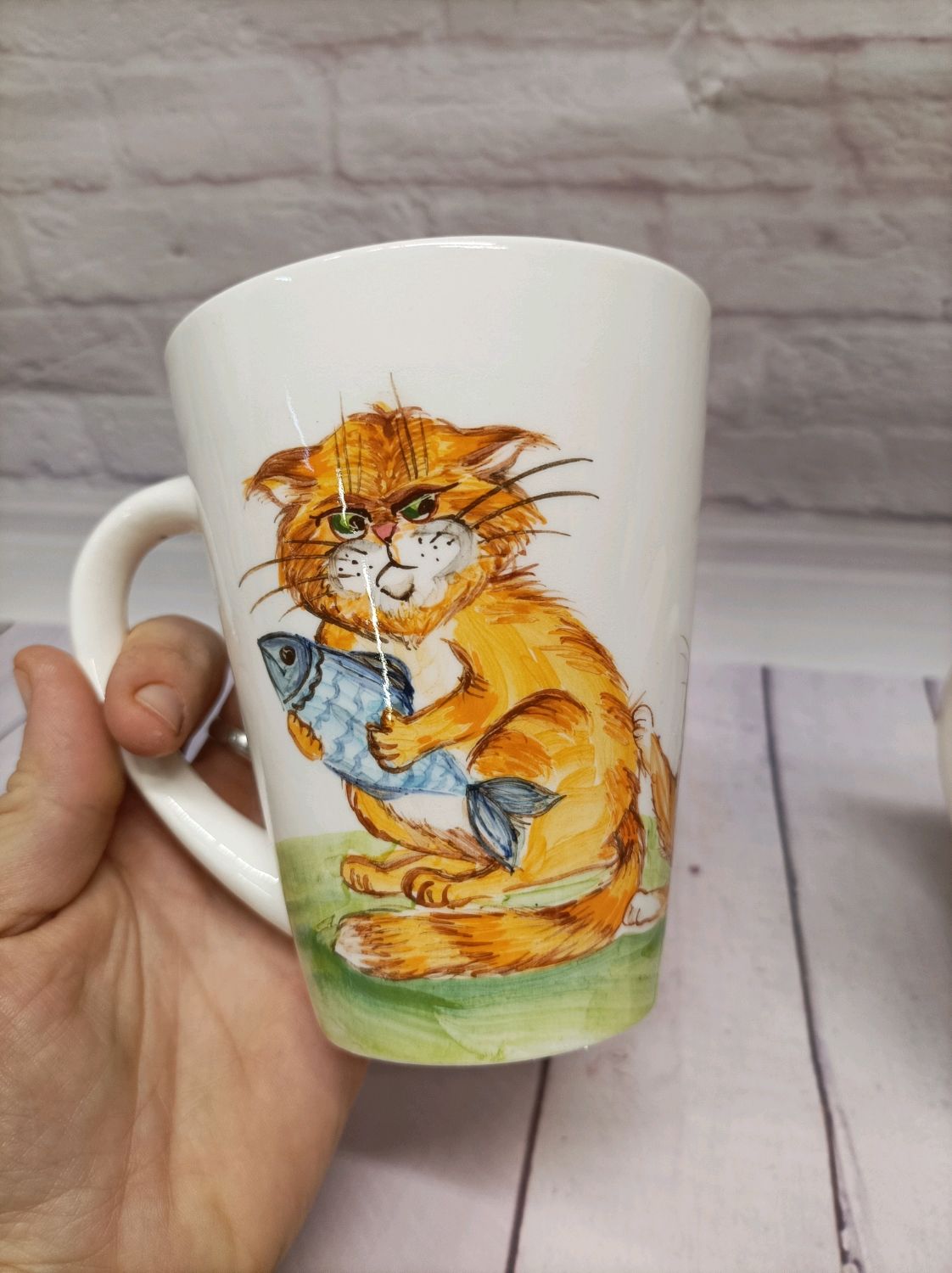 Кот в чашке