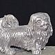 The miniature figure `Pekinese`. There are figurines of dogs of other breeds: Bichon Frise, Airedale Terrier, poodle, Spaniel, Dachshund. There are figurines of other animals: bear, elephant, turtle, 