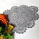 knitted doily, doily crochet, doily lace, doily delicate track on the table, autumn leaves.
