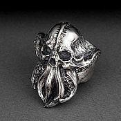 A ring with a skull made of silver