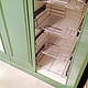 Multifunctional large built-in wardrobe. Has three large wing equipped with storage units in the lower tier and three spacious lofts on the upper tier.