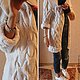 Photo. Elegant, if I may say so about a knitted cardigan. 
Color knit cardigan - white