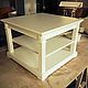 Coffee table with square top. has two compartments for storing books, magazines, Souvenirs. Decorative plates with flutings give the table uncluttered and aesthetically pleasing appearance. The differ