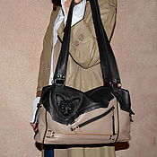 Leather backpack with a cat