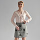 The skirt is gray tweed.
