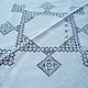 The middle of the tablecloth. General view. Round white linen tablecloth with embroidery strojeva embroidery white on white decoration, table decoration, retro style, Country interior
