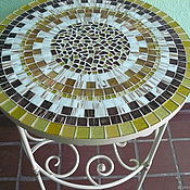 Wrought iron table with a mosaic of 