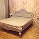 Bed made of solid noble walnut and rattan, covered with a white stain and varnish with elements of aging, reflects the old world glamour and European chic. A stunning accent for the bedroom, throws hi
