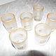 Set of 6 glass shots for vodka hand painted. This set will decorate Your table original stacks with the picture with gold paint and the effect of `frost`. Around the edge is gold plated ornament.
