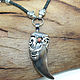 Pendant-an amulet of the bear claw silver garnet . Handmade. Product weight 17 g.
