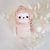 A small fluffy owl in a cap, 11 cm