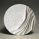 Round relief painting. White plaster panel
