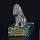 Miniature `Spaniel`. There are figurines of dogs of other breeds: Bichon Frise, Airedale Terrier, poodle, Dachshund, Pekingese. There are figurines of other animals: bear, elephant, turtle, cat, mouse
